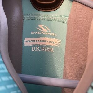 One time used Stearn Life Jacket Size Adult XXS or Youth Large